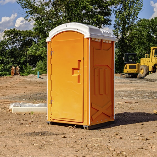 what is the cost difference between standard and deluxe portable restroom rentals in Montour